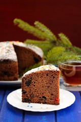 Chocolate fruit christmas cake with green fur tree branch