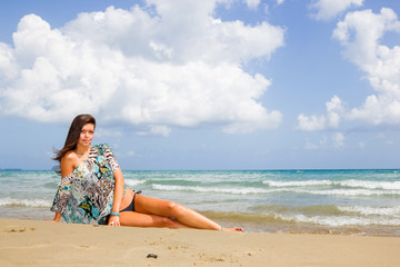 Pretty young woman in bikini on the beach