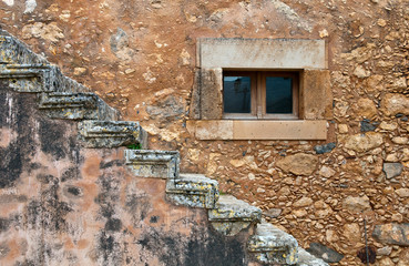 Abstract  details stone wall closed window and stairs