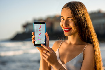 Woman showing phone with navigation map