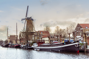 The museum harbor of Gouda in the Netherlands with monumental ships from the beginning of 1900.