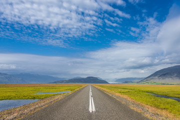 Fototapeta na wymiar Isolated road and Icelandic landscape at Iceland, summer time