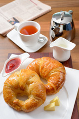 Continental breakfast with croissant, jam and English tea