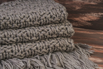 knitted scarf on wooden background