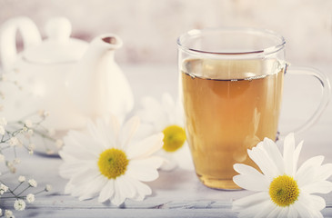 Cup of tea with chamomile flower