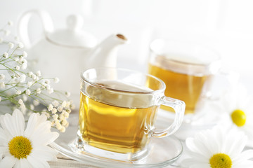 Cup of tea with chamomile flower
