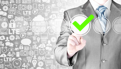business man touching, pressing modern button with green ticking Check Box