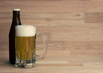 Lager beer in glass and bottle