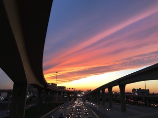 sunset over congested freeway