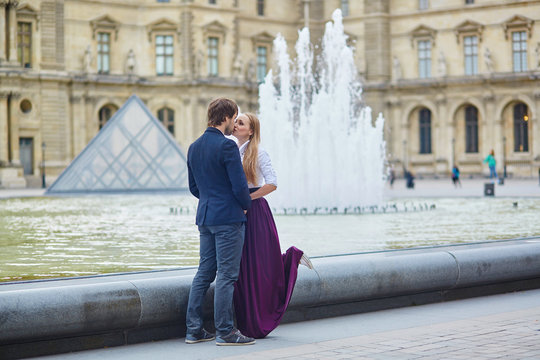 Beautiful couple having a date in Palais Royal in Paris