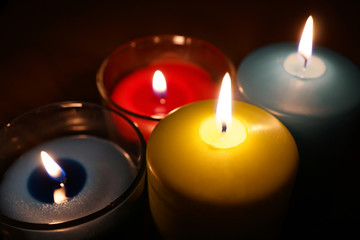 burning candle isolated on black