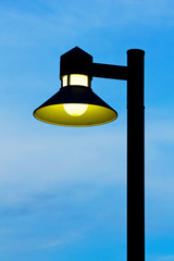 ornate street light against a blue sky background