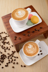 Coffee and pastries on old wooden table