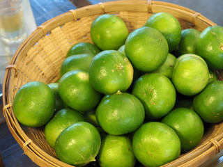 Limes in wood basket