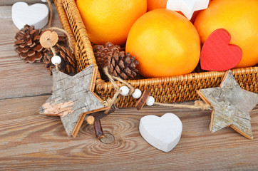 Orange in wickered tray with Christmas decor
