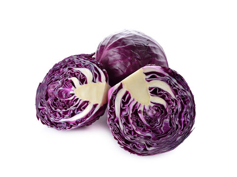 whole and half cut fresh red cabbage on white background