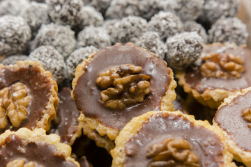 candy cupcake with walnut and rum balls in the background
