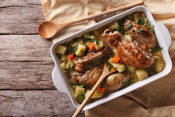 Pieces of chicken stewed with vegetables. Horizontal top view
