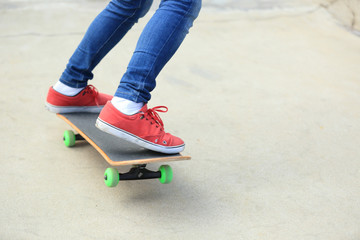 skateboarding legs at skatepark
