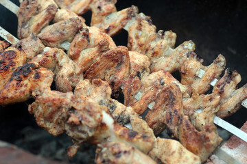 Chicken on the grill to cook