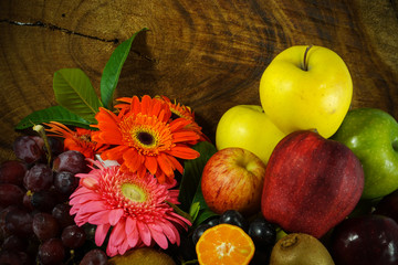 Assortment of exotic fruits on wood background.