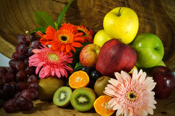 Naklejka na ściany i meble Assortment of exotic fruits on wood background.