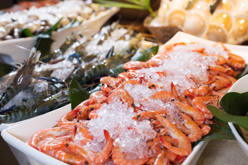 fresh seafood on table in cooking room