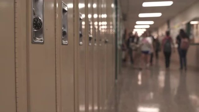 Students walking down hall by lockers