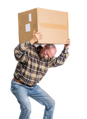 Senior man carries a heavy box