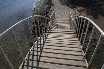 Wooden bridge with iron railing. El Gouna. Egypt.