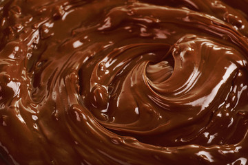 Background of melted milk chocolate, close-up