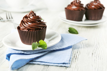 Chocolate cupcakes served on table