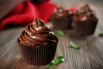 Chocolate cupcakes and napkin on table