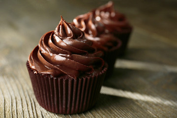 Chocolate cupcakes on wooden table