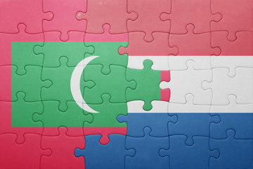 puzzle with the national flag of netherlands and maldives
