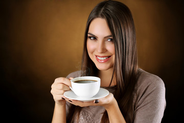 Portrait of smiling pretty woman with cup of coffee