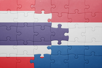 puzzle with the national flag of netherlands and thailand