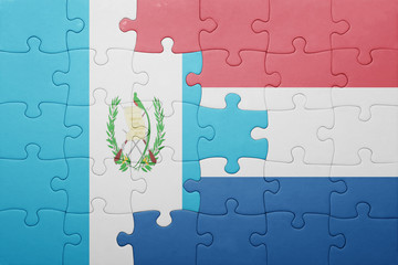 puzzle with the national flag of netherlands and guatemala