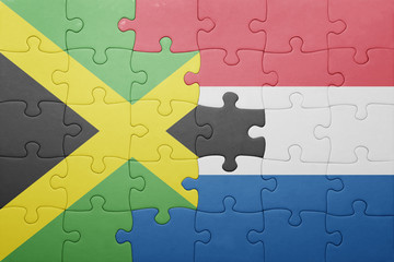 puzzle with the national flag of netherlands and jamaica