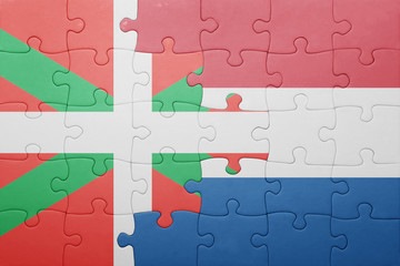 puzzle with the national flag of netherlands and basque country
