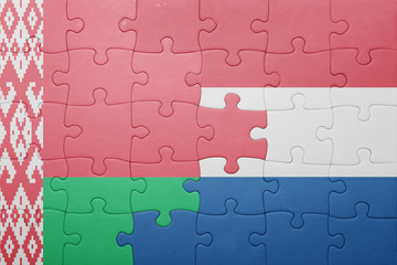 puzzle with the national flag of netherlands and belarus