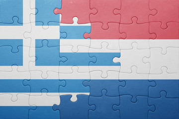Fototapeta premium puzzle with the national flag of netherlands and greece