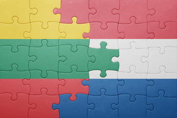 Fototapeta premium puzzle with the national flag of netherlands and lithuania