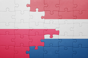 Fototapeta premium puzzle with the national flag of netherlands and poland