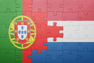 puzzle with the national flag of netherlands and portugal