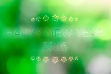 Happy New Year 2016 on the bokeh background and star