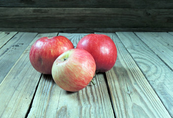 Apples on a wooden background