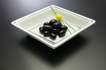 Kuromame(sweeten black beans); a Japanese traditional food to celebrate New Year.