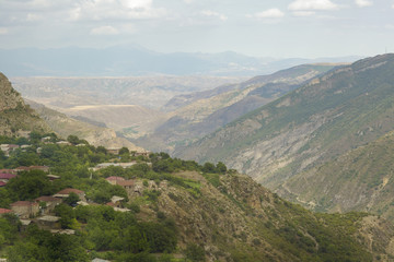 Fototapeta na wymiar Village is in the mountains, the landscape. A village in Armenia, near Tatev. 