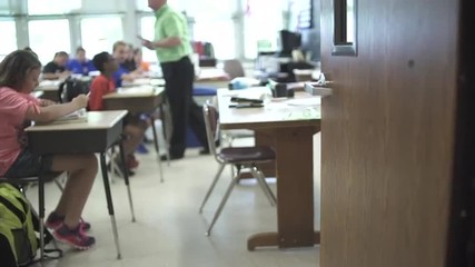 Students working at their desks in a classroom